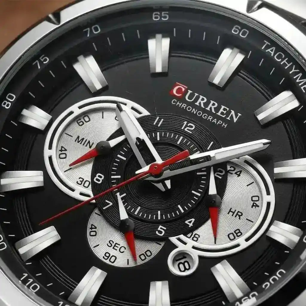 Relógio Masculino Quartzo Velthor Black com close no mostrador preto exibindo sub-dials cronográficos e ponteiros luminosos em detalhe